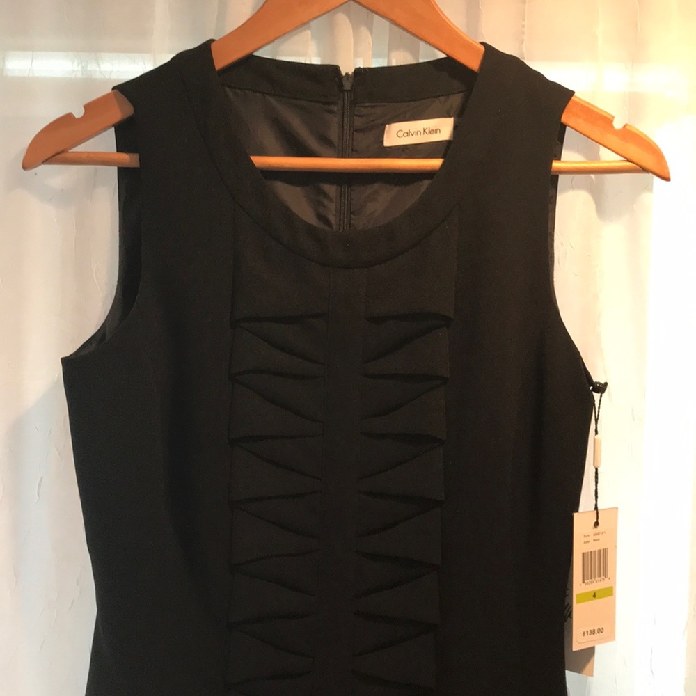 Calvin Klein size 4 stunning little black dress.